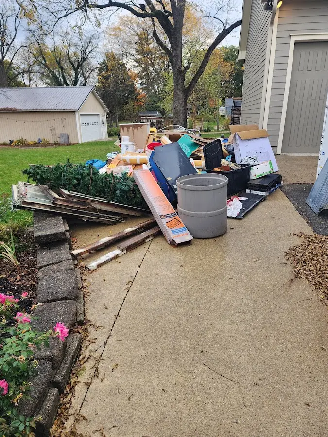 Dumpster being loaded with debris for 3 Yard Dumpster Rental in Harlingen